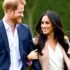 Prince Harry and Meghan smiling and walking together.